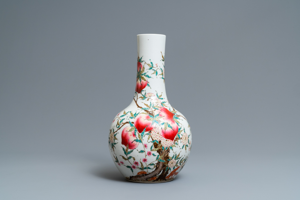 A Chinese famille rose 'nine peaches' bottle vase, Guangxu mark, 19/20th C.