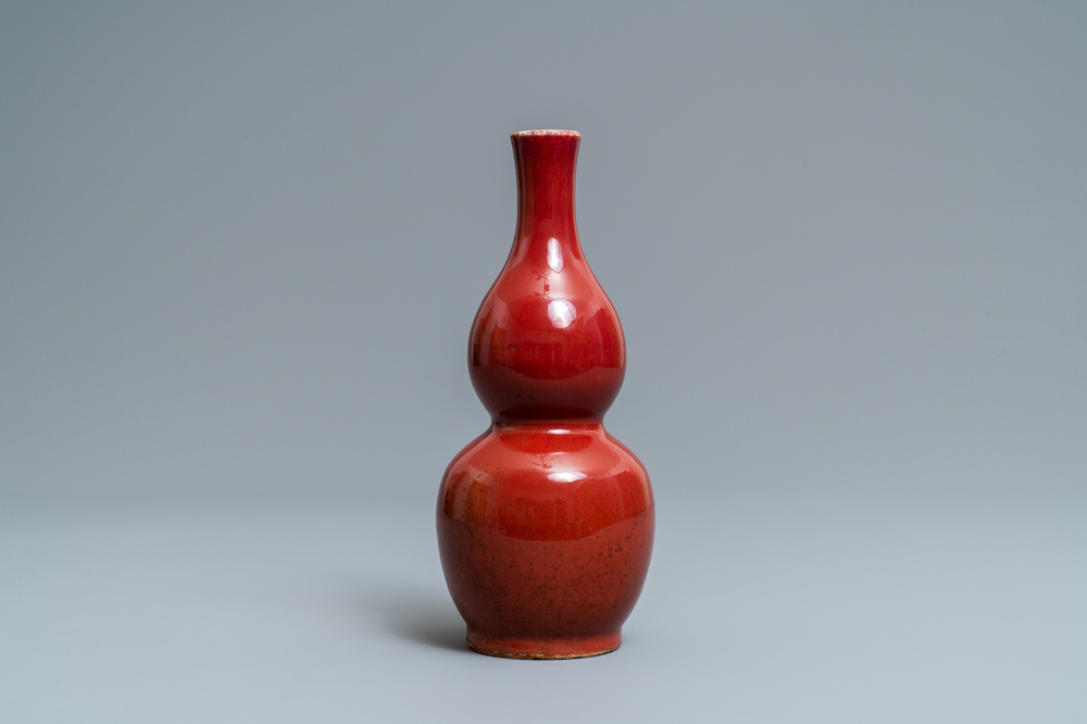 A Chinese monochrome sang-de-boeuf double gourd vase, Qianlong mark, 19/20th C.