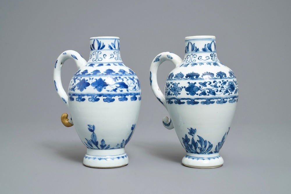 A pair of Chinese blue and white ewers, Transitional period