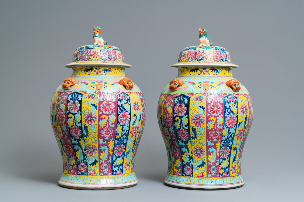 A pair of large Chinese famille rose vases and covers, 19th C.