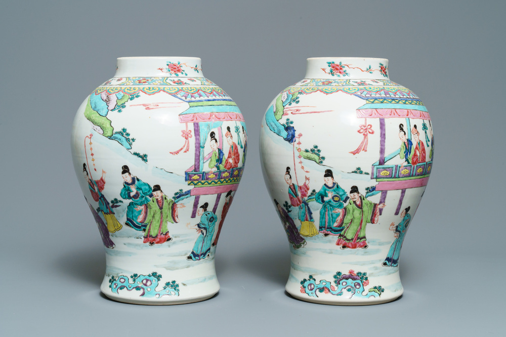 A pair of Chinese famille rose vases with figures in a garden, Yongzheng