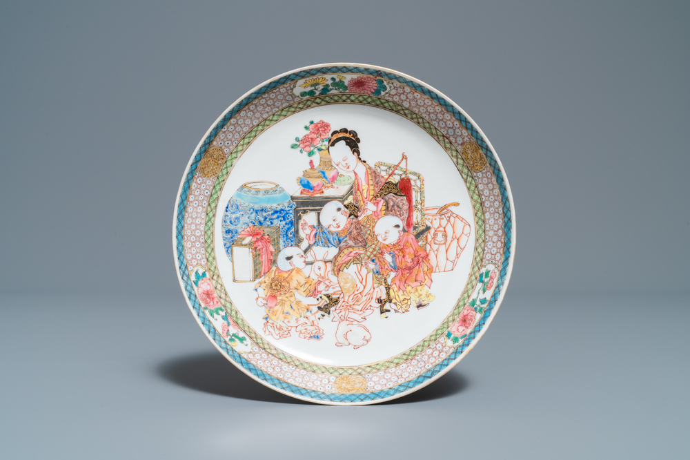 A fine Chinese famille rose plate with a lady and three boys, Yongzheng