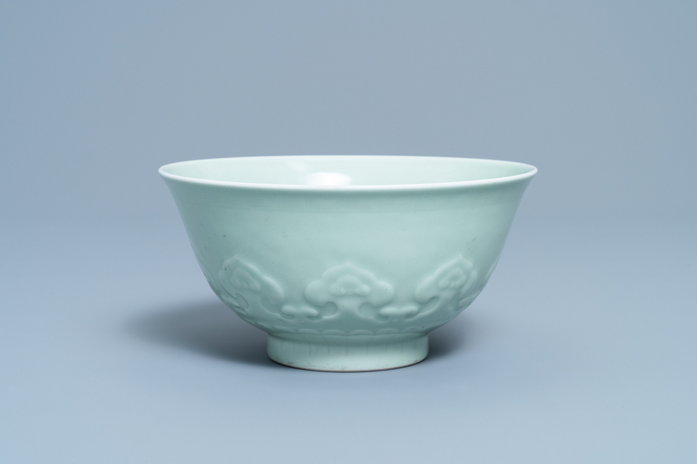 A Chinese moulded monochrome celadon bowl with incised design, Qianlong mark, 19th C.