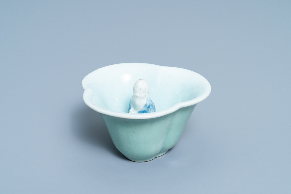 A Chinese blue, white and celadon-glazed 'Lu Hong Jian' puzzle or trick cup, Qianlong