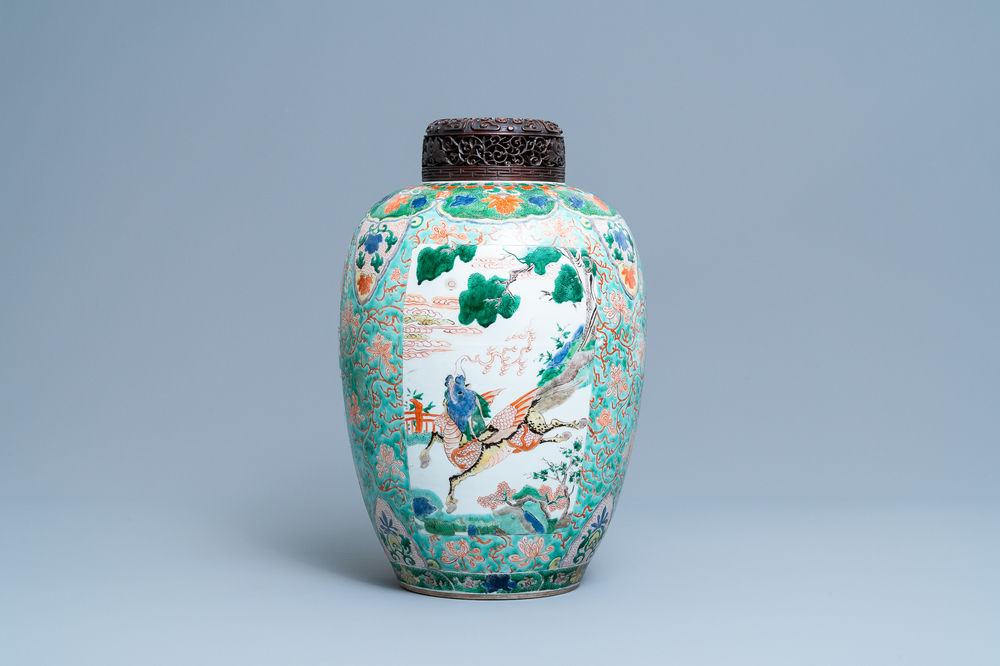 A large Chinese famille verte 'mythical beasts' jar with wooden cover, Kangxi