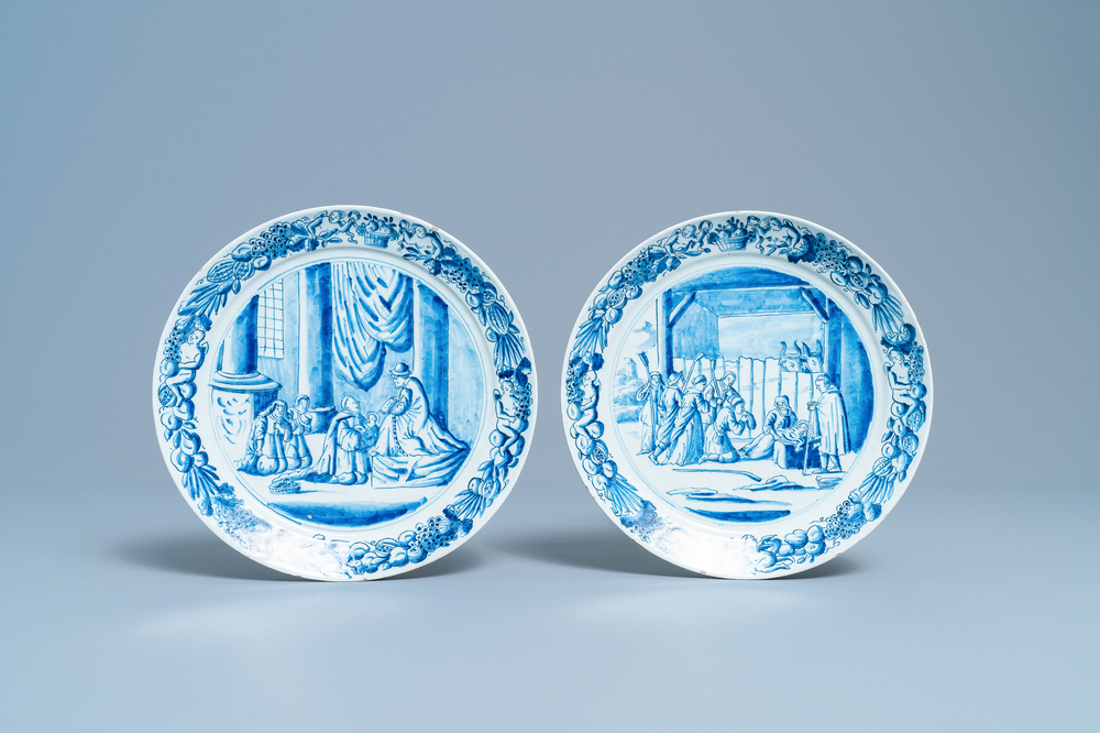 A pair of Dutch Delft blue and white plates with biblical scenes, 18th C.