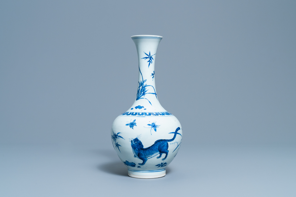 A rare Chinese blue and white bottle vase with a tiger and two butterflies, Transitional period