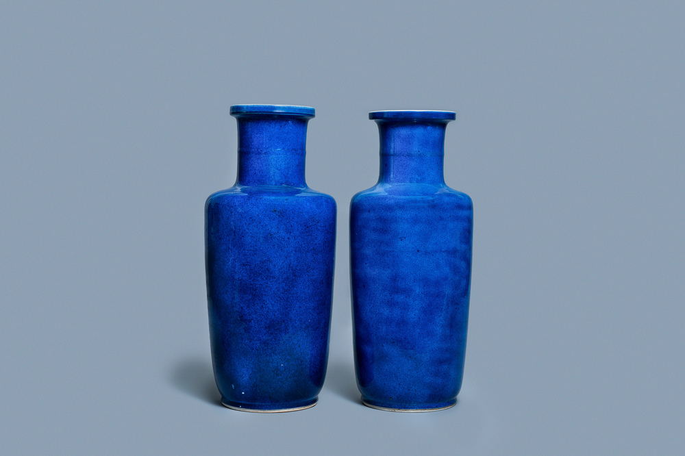 A pair of Chinese monochrome powder blue rouleau vases, Kangxi