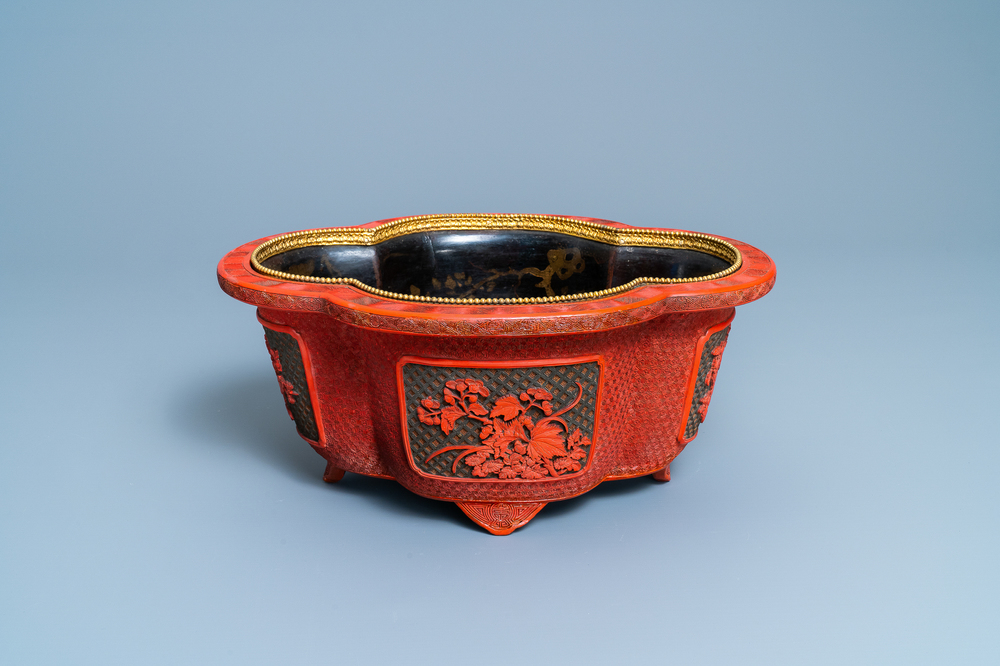 A Chinese quatrefoil jardini&egrave;re in red and black lacquer, Qianlong