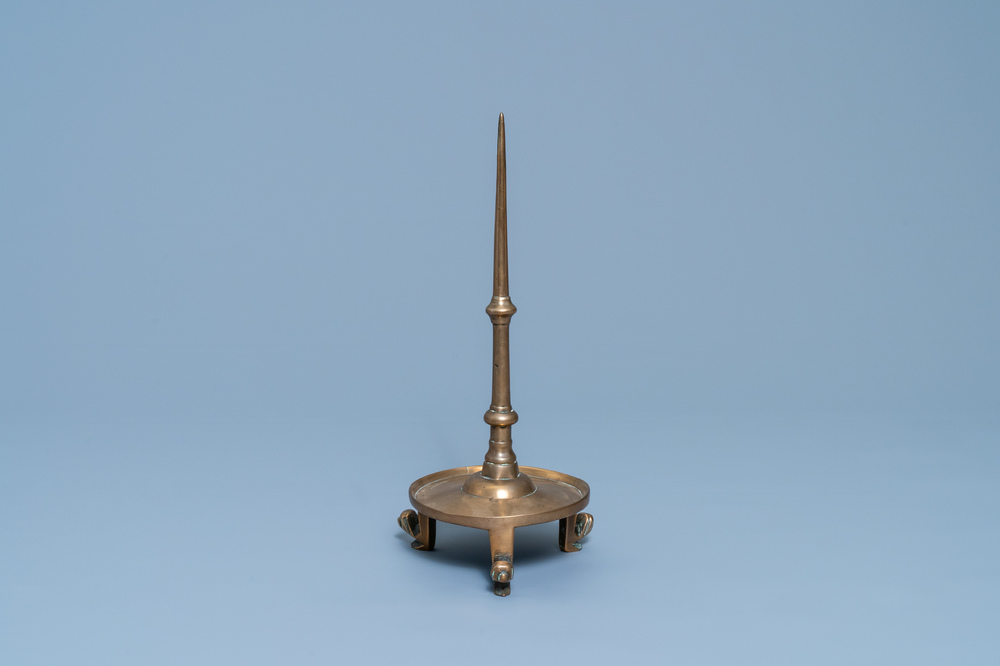 A Flemish or Dutch bronze candlestick, 14/15th C.