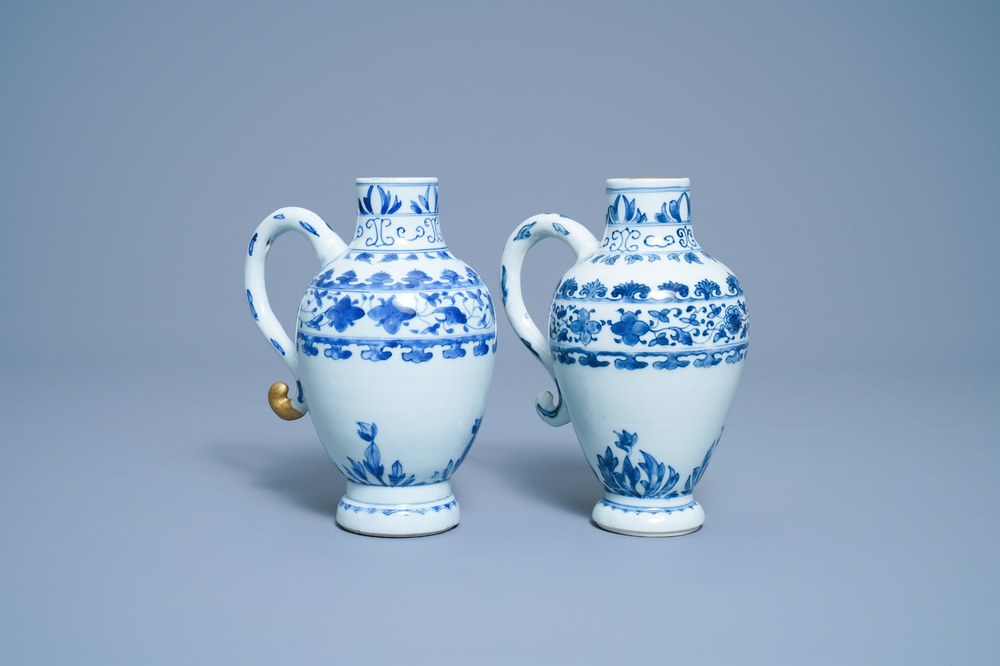 A pair of Chinese blue and white ewers, Transitional period