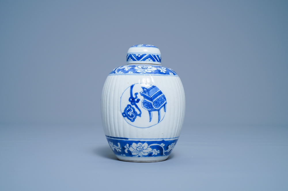 A Chinese ribbed blue and white jar and cover, Kangxi