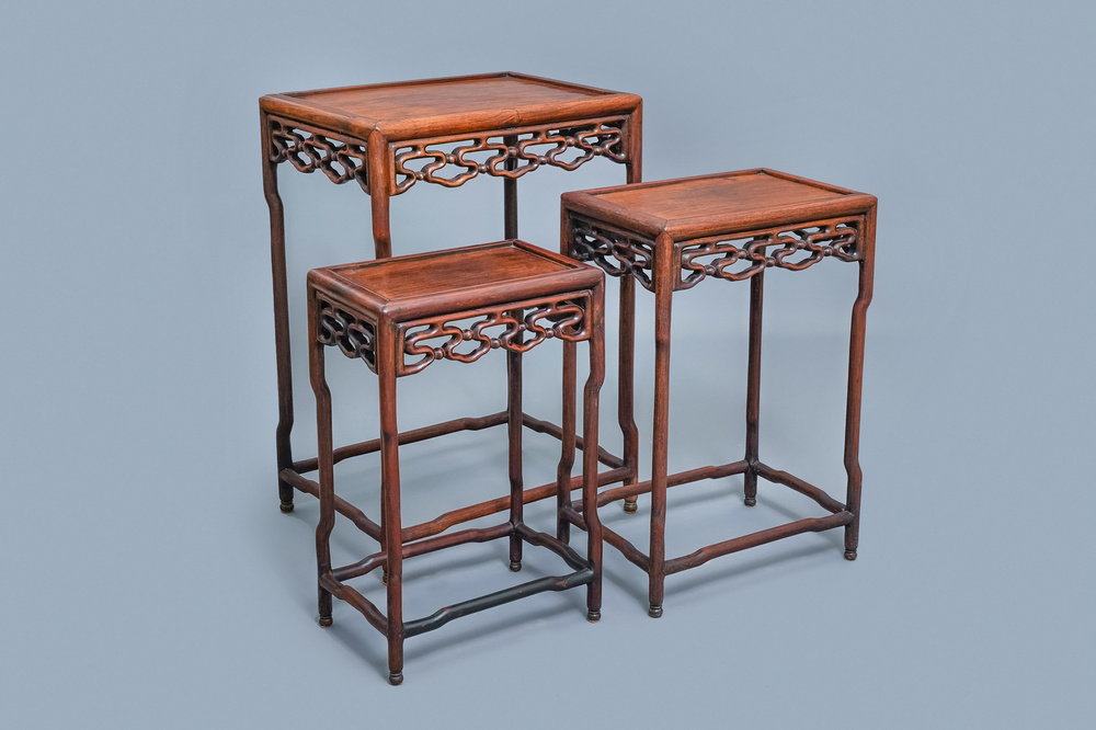 Three Chinese wooden nesting side tables, 19th C.