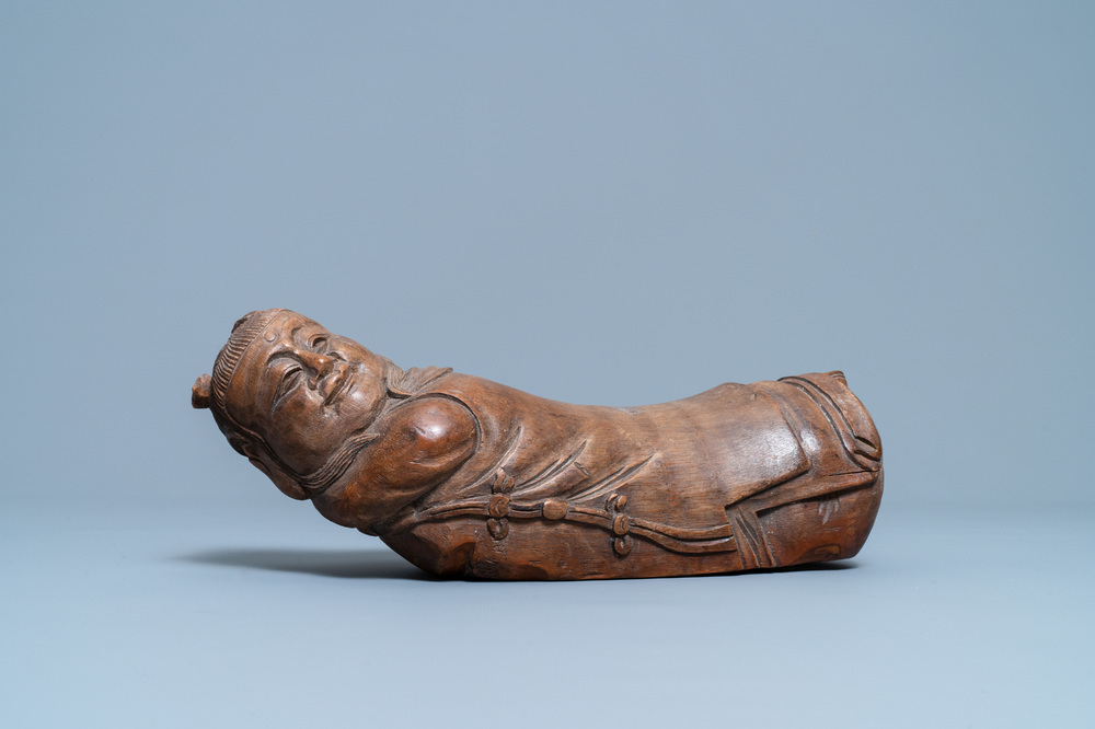 A Chinese bamboo 'recumbent boy' pillow, 19th C.