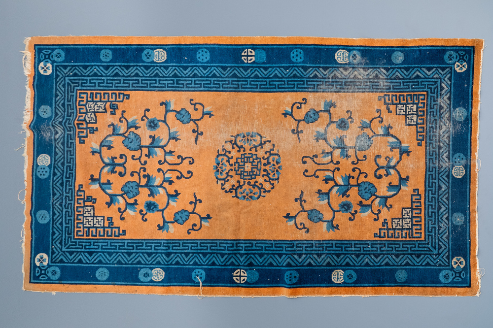 A large Chinese rectangular carpet, 19th C.