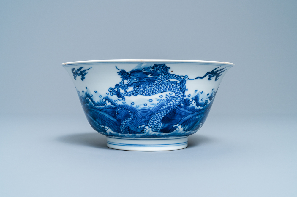 A Chinese blue and white 'dragon and carps' bowl, Xuande mark, Kangxi