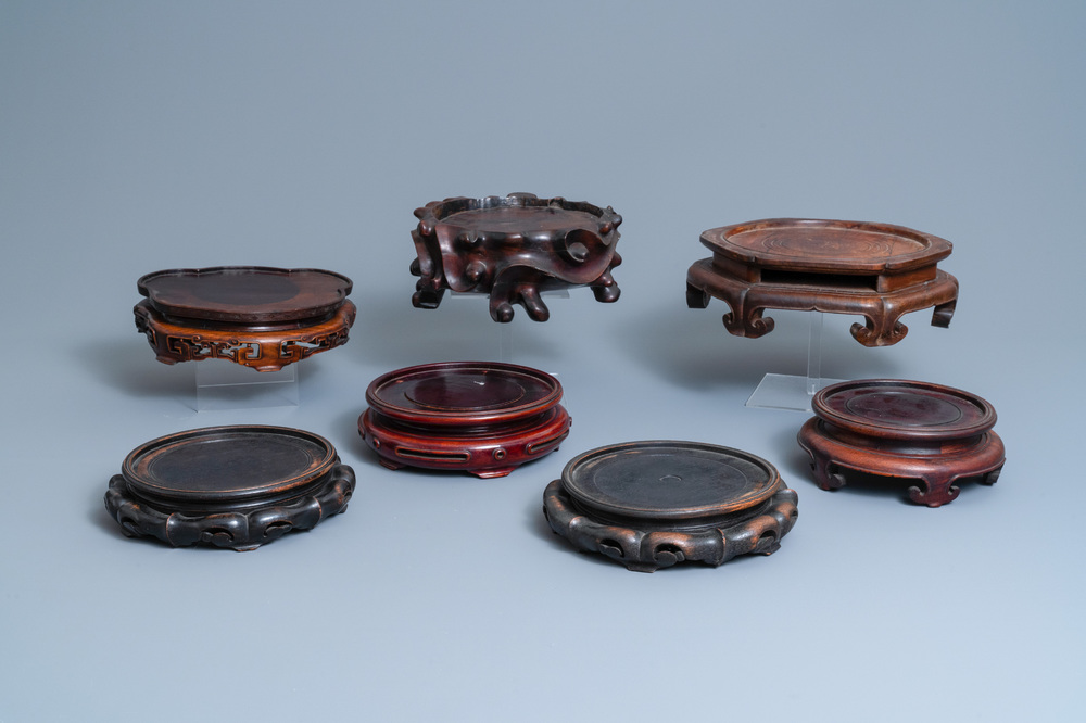 Seven large Chinese carved wooden stands, 19/20th C.