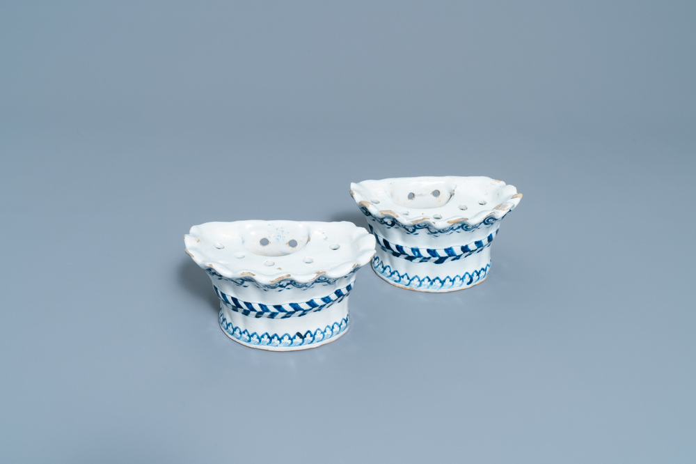 A pair of blue and white French faience bouqueti&egrave;res or wall flower holders, Lille, 18th C.