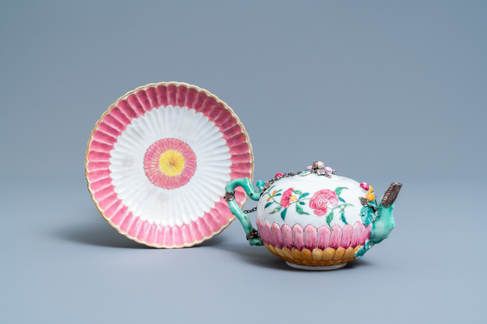 A Chinese famille rose teapot on stand with applied floral design, Yongzheng