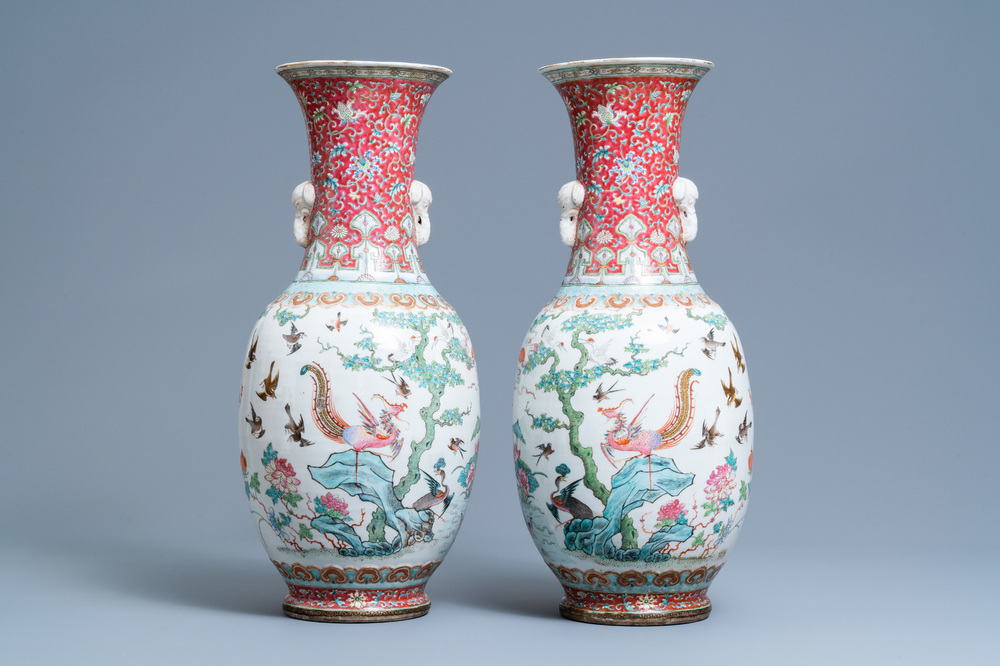 A pair of Chinese famille rose 'phoenix' vases, Tongzhi mark and of the period