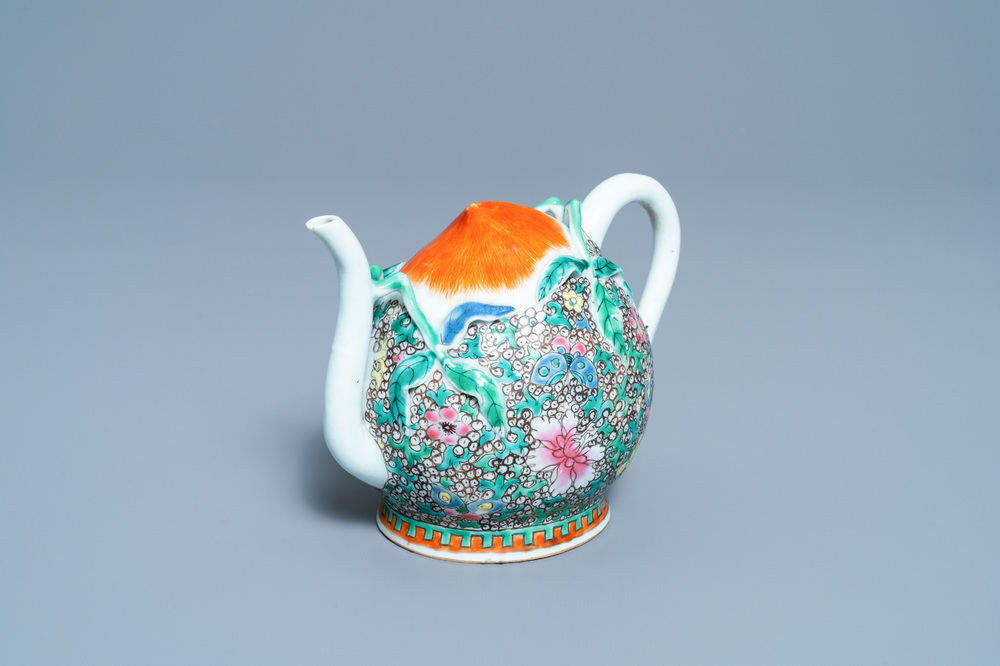 A Chinese famille rose peach-shaped 'cadogan' teapot with applied floral design, Qianlong