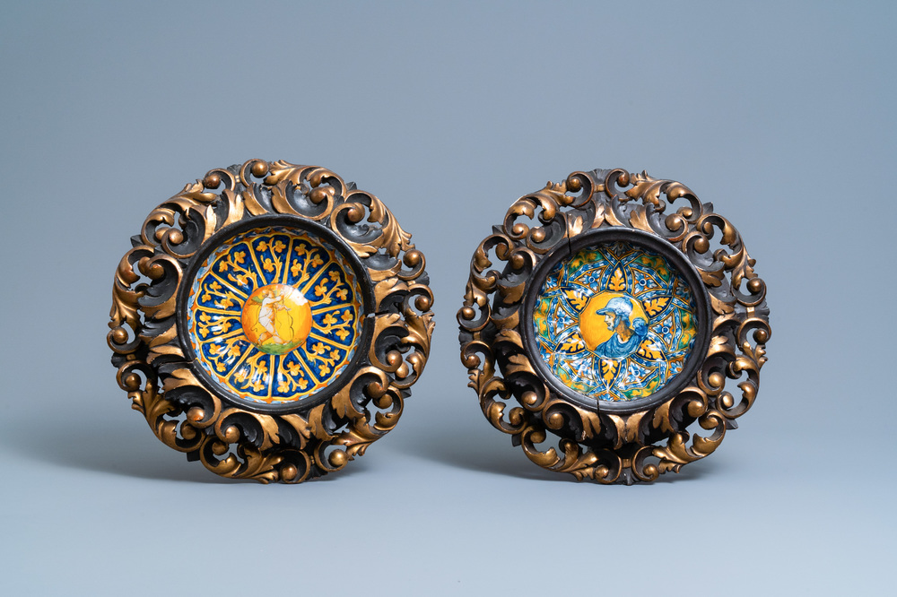 Two polychrome Italian maiolica crespina in finely carved wooden frames, Faenza and Montelupo, 16/17th C.