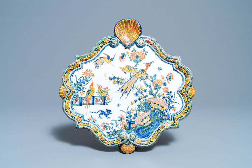 A polychrome Dutch Delft plaque with birds in a Chinese garden, 18th C.