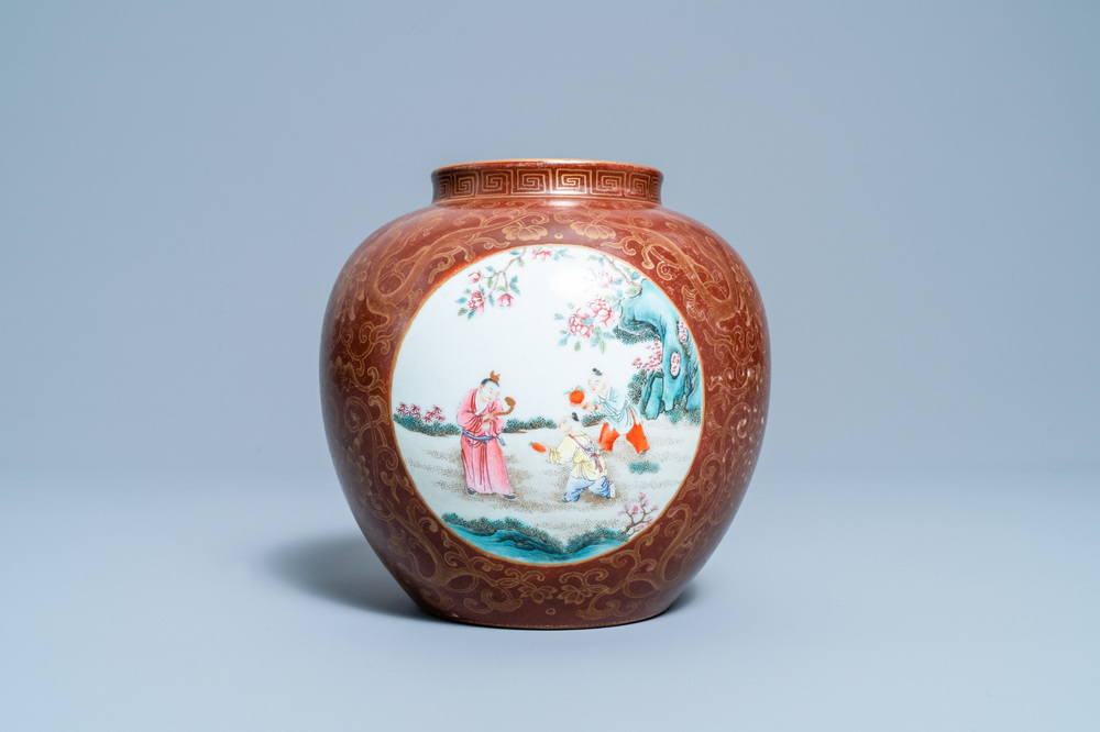 A Chinese gilt-decorated caf&eacute;-au-lait-ground famille rose vase, Qianlong mark, 20th C.