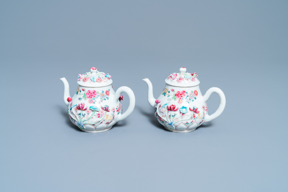 A pair of Chinese famille rose relief-decorated teapots and covers, Yongzheng