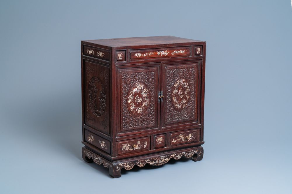 A Chinese mother-of-pearl-inlaid wooden two-door cabinet, 19th C.