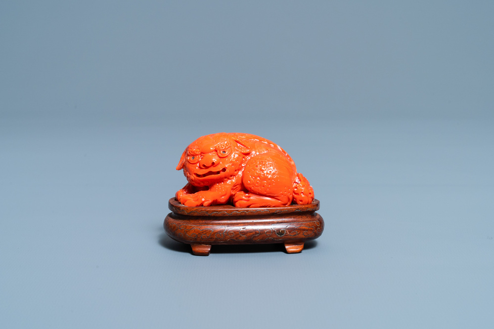 A Chinese carved red coral model of a Buddhist lion, 19/20th C.