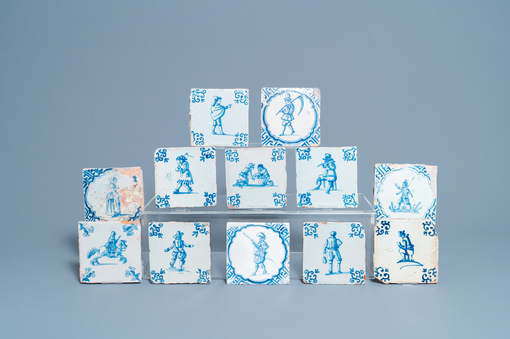 Twelve Dutch Delft blue and white tiles with figures, 17th C.