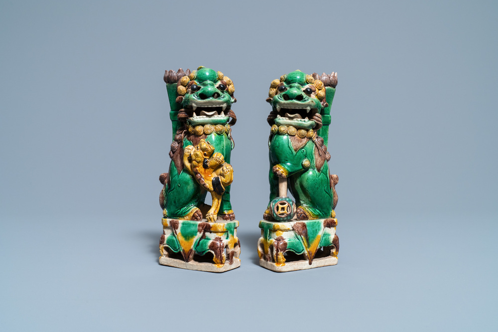 A pair of Chinese sancai-glazed biscuit Buddhist lion joss stick holders, Kangxi