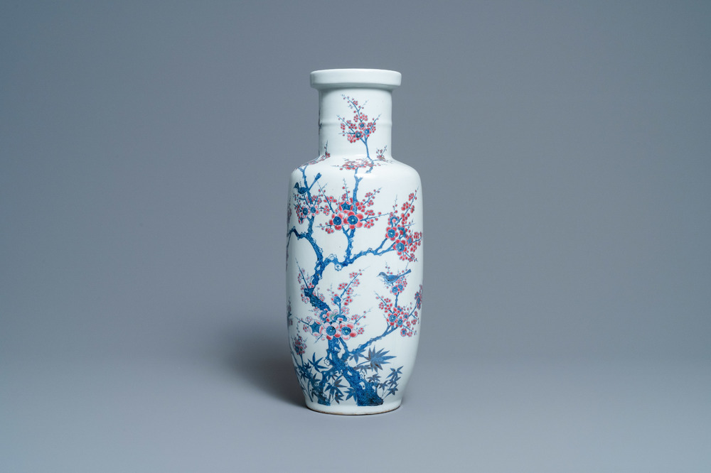 A Chinese blue, white and copper-red rouleau vase with birds among blossoming branches, 20th C.