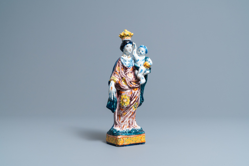 A polychrome Dutch Delft figure of the Madonna with child, 18th C.