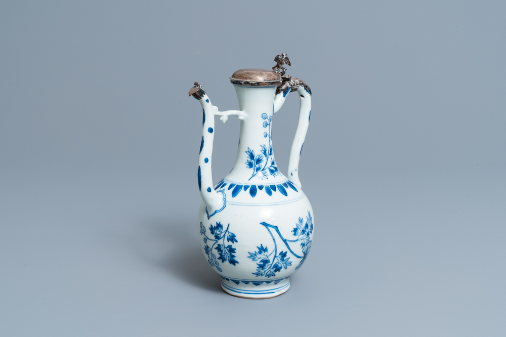 A Chinese blue and white silver-mounted ewer and cover, Transitional period