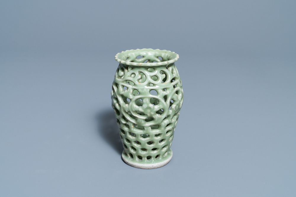 A Chinese reticulated monochrome Longquan celadon brush pot, Ming