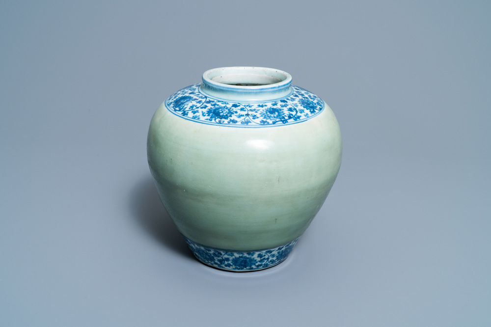 A Chinese celadon-ground and blue and white 'lotus scroll' jar, Ming