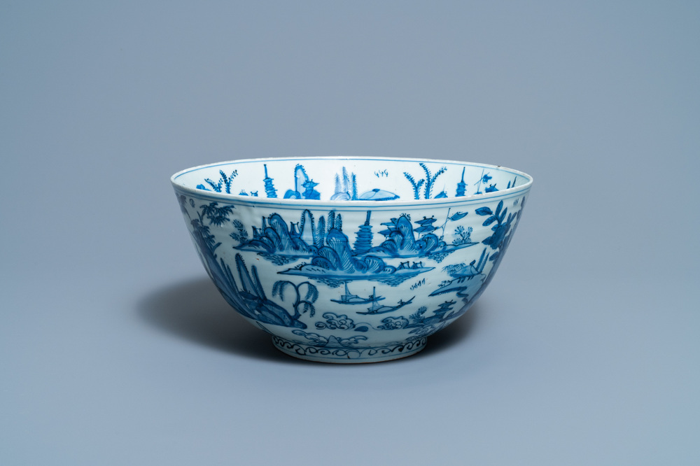 A large Chinese blue and white 'river landscape' bowl, Ming