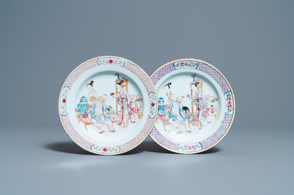 A pair of fine Chinese famille rose ruby back plates with figures in an interior, Yongzheng