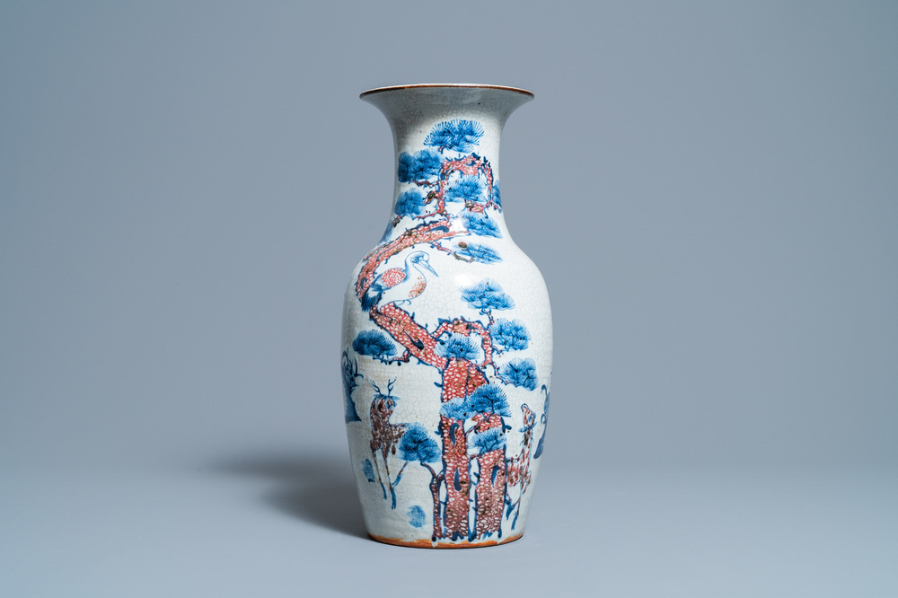 A Chinese blue, white and copper-red 'deer and crane' vase, 19th C.