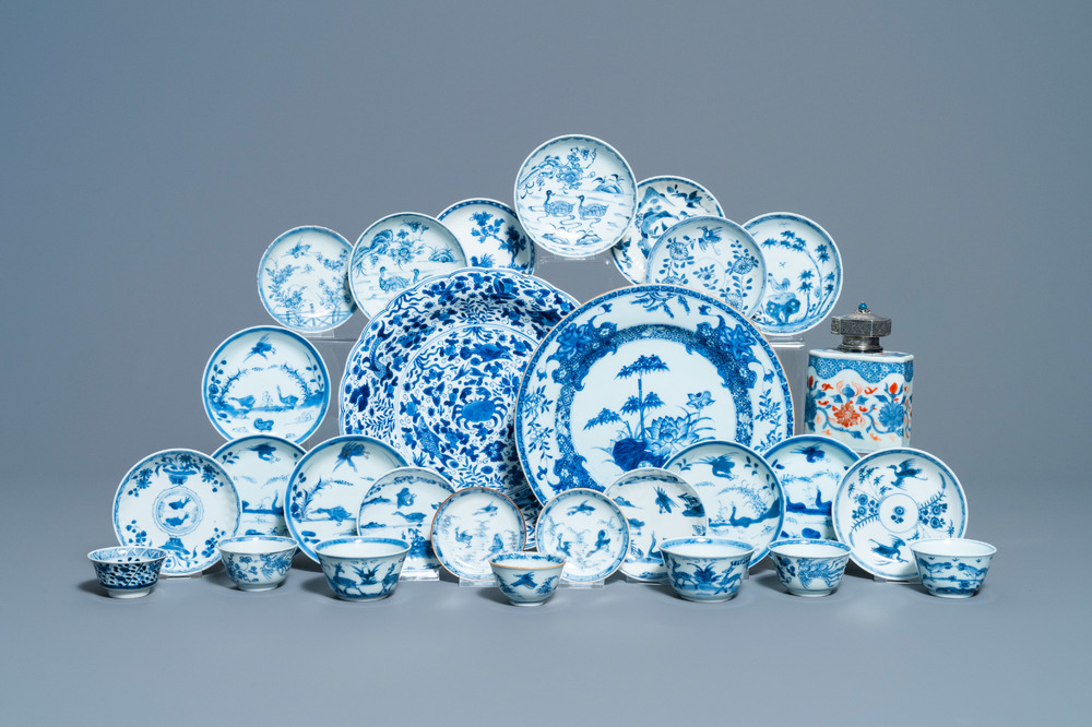 Eighteen Chinese blue and white saucers, seven cups, two dishes and a tea caddy, Kangxi/Qianlong