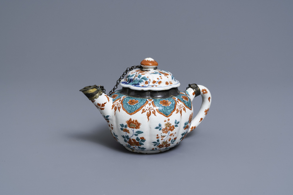 A polychrome petit feu and gilded Dutch Delft teapot and cover, early 18th C.