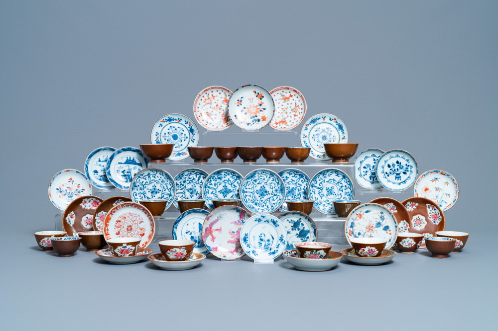 31 Chinese capucine brown-ground saucers and 22 cups, Kangxi/Qianlong