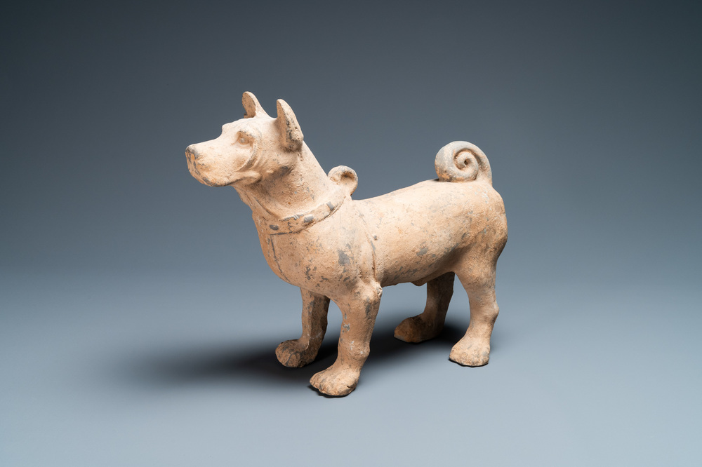 A large Chinese grey pottery model of a dog, Han