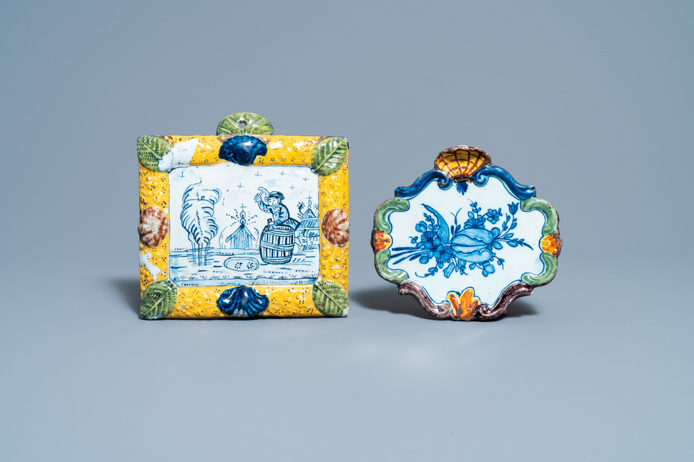 A Dutch Delft mixed technique plaque with a barrel maker and one with a tulip, 18th C.