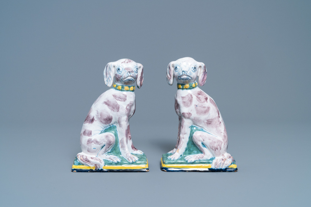 A pair of polychrome Dutch Delft money banks modelled as dogs, 18th C.