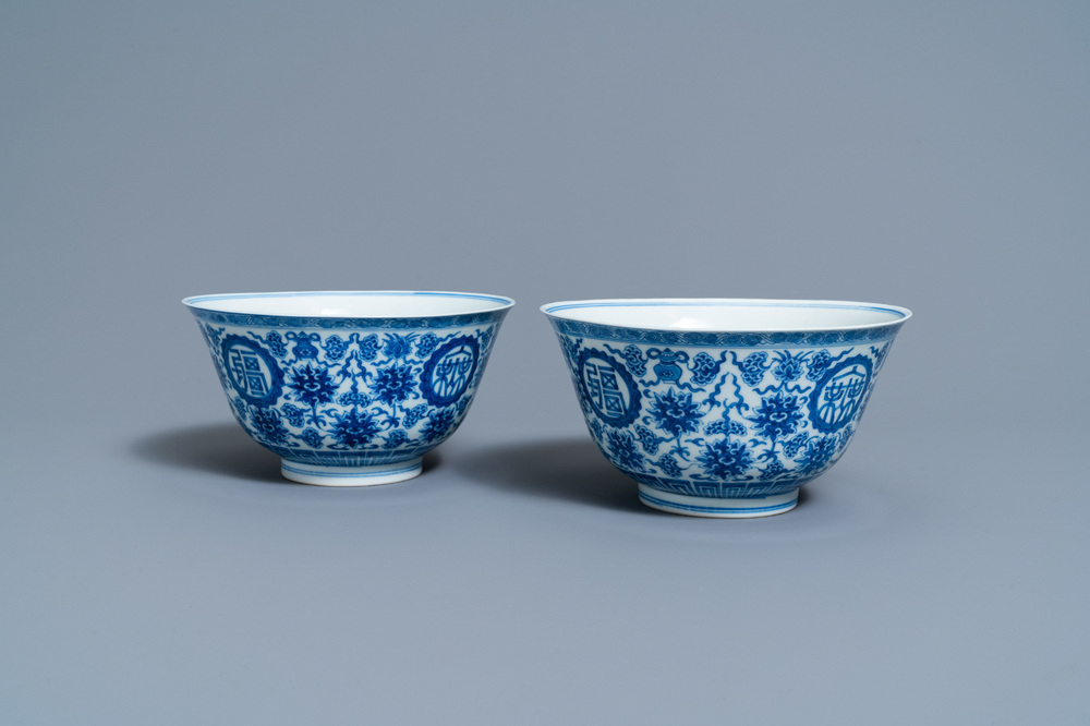 A pair of Chinese blue and white 'wan shou wu jiang' bowls, Qianlong mark and of the period