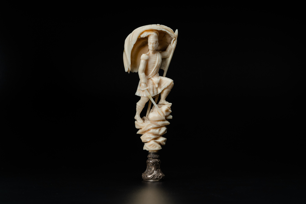 An ivory and silver seal stamp with a hussar handle, 19th C.