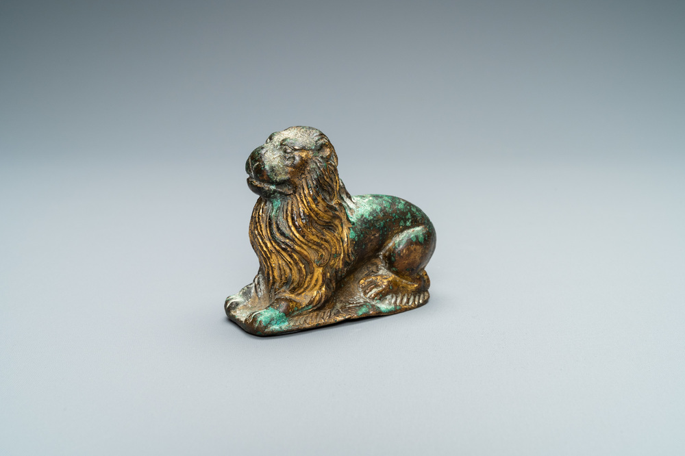 A gilt-bronze model of a recumbent lion, France, 14th C.